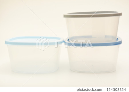 Large containers for food. Three plastic containers with a blue lid for food on a white background. Large containers for food. Three plastic containers with a blue lid for food on a white background. 134308834