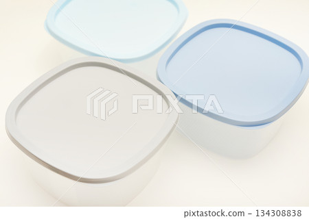 Large containers for food. Three plastic containers with a blue lid for food on a white background. Large containers for food. Three plastic containers with a blue lid for food on a white background. 134308838