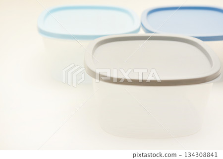 Large containers for food. Three plastic containers with a blue lid for food on a white background. Large containers for food. Three plastic containers with a blue lid for food on a white background. 134308841