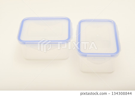Small containers for food. Two plastic containers with a blue lid for food on a white background. 134308844