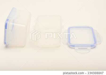 Small containers for food. Two plastic containers with a blue lid for food on a white background. 134308847