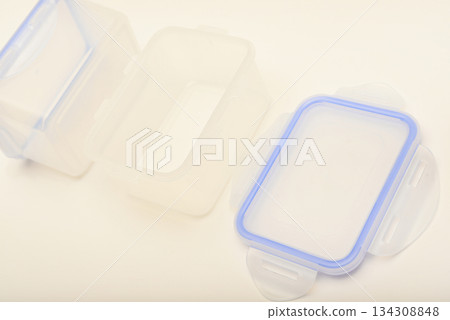 Small containers for food. Two plastic containers with a blue lid for food on a white background. Small containers for food. Two plastic containers with a blue lid for food on a white background. 134308848