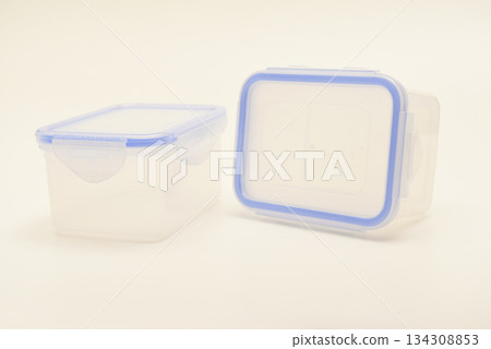 Small containers for food. Two plastic containers with a blue lid for food on a white background. Small containers for food. Two plastic containers with a blue lid for food on a white background. 134308853