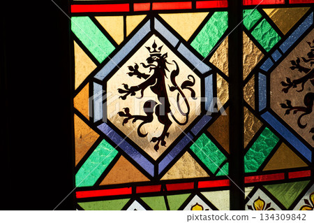 Beautifully illuminated stained glass with historic Czech motifs, colorful light, Gothic atmosphere and architectural heritage in Prague, Czech republic Beautifully illuminated stained glass with historic Czech motifs, colorful light, Gothic atmosphere and architectural heritage in Prague, Czech republic 134309842