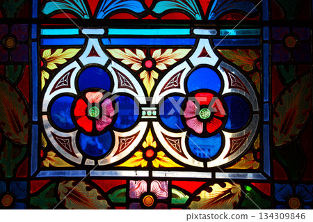 Beautifully illuminated stained glass with historic Czech motifs, colorful light, Gothic atmosphere and architectural heritage in Prague, Czech republic 134309846