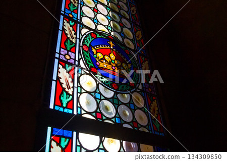 Beautifully illuminated stained glass with historic Czech motifs, colorful light, Gothic atmosphere and architectural heritage in Prague, Czech republic Beautifully illuminated stained glass with historic Czech motifs, colorful light, Gothic atmosphere and architectural heritage in Prague, Czech republic 134309850