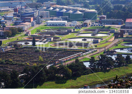 Sewage water treatment plant, storage tanks, water shortage and global warming concept, aerial view Sewage water treatment plant, storage tanks, water shortage and global warming concept, aerial view 134310358