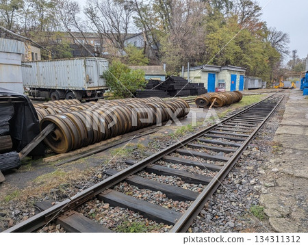 An open-air warehouse for train car wheels 134311312