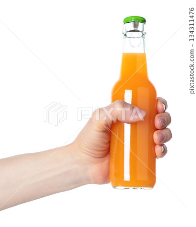 Hand holding a glass bottle filled with orange juice, isolated on transparent background. Suitable for food, drink, freshness, citrus, and healthy lifestyle projects Hand holding a glass bottle filled with orange juice, isolated on transparent background. Suitable for food, drink, freshness, citrus, and healthy lifestyle projects 134311476