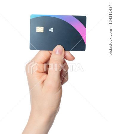 Hand holding a bank card with a chip, isolated on transparent background. Ideal for finance, payment, banking, digital transactions, and security-themed projects 134311484