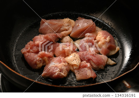 Juicy chicken thighs fried in a frying pan Juicy chicken thighs fried in a frying pan 134316191