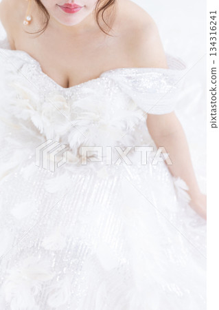 A woman in a white dress A woman in a white dress 134316241
