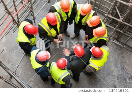 Construction Team Meeting with Project Manager and Architect in Safety Gear 134316501