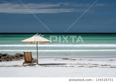 High Angle View of a Beach Umbrella Casting Shade on a Tranquil Coastal Scene 134316731