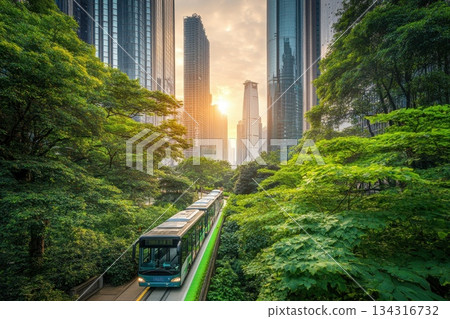 Futuristic Cityscape with Electric Buses Surrounded by Lush Greenery at Sunset 134316732