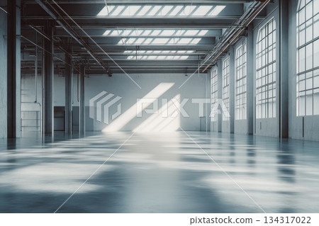 Expansive Industrial Warehouse Interior with Natural Light Through Skylights Expansive Industrial Warehouse Interior with Natural Light Through Skylights 134317022