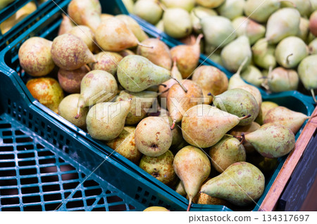 Sweet pear laid out in a container at the market 134317697