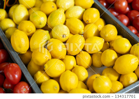 View of lemons in a wicker basket, put up for sale in store View of lemons in a wicker basket, put up for sale in store 134317701