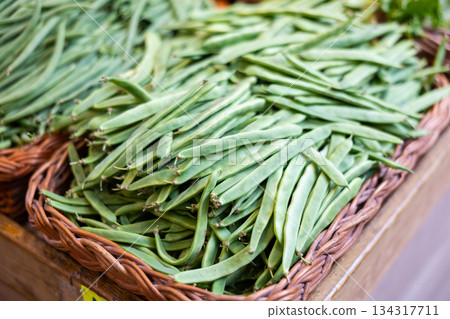 Green string beans in a supermarket drawer 134317711