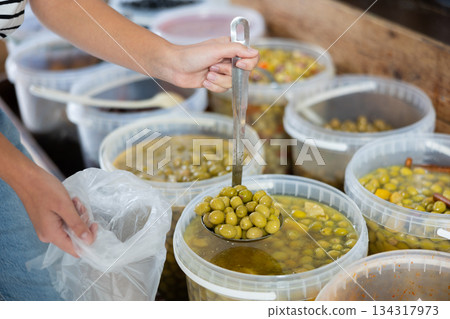 Salted olives in a container at the market Salted olives in a container at the market 134317973