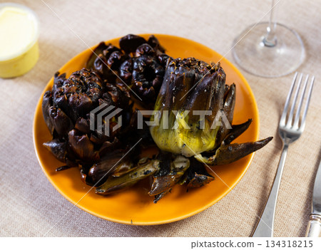Fried or baked artichokes are dietary dish of Mediterranean cuisine Fried or baked artichokes are dietary dish of Mediterranean cuisine 134318215
