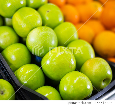 Many of fresh green apples on market, puts out for sale 134318222