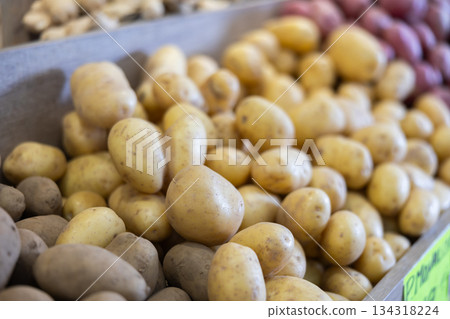 Farm potatoes in a basket at the market 134318224