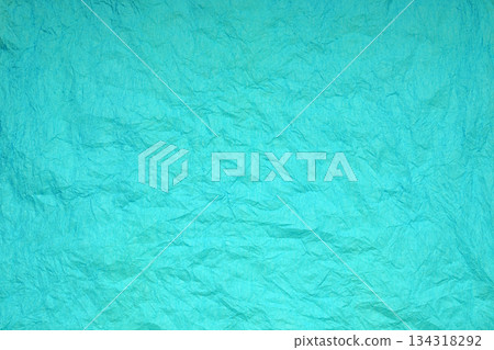 abstract texture of rumpled paper in a rich turquoise color 134318292