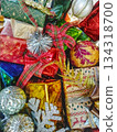 Festive and colorful gifts and decorations for special occasions. Featuring a variety of presents, shiny baubles, and festive decorations, with ribbons, bows, and wrapping paper 134318700