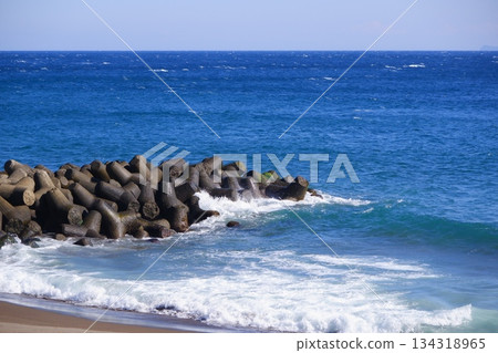 Ocean - A tranquil coastal landscape with a beautiful blue ocean stretching to the horizon and a refreshing blue sky. Ocean - A tranquil coastal landscape with a beautiful blue ocean stretching to the horizon and a refreshing blue sky. 134318965