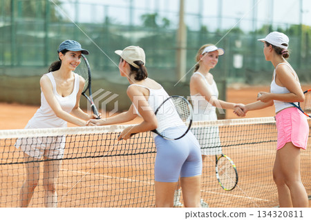 Women members of tennis club shake hands Women members of tennis club shake hands 134320811