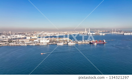 Drone aerial view of port city and ships Drone aerial view of port city and ships 134321297