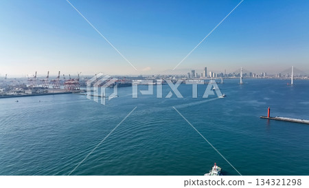 Drone aerial view of port city and ships Drone aerial view of port city and ships 134321298