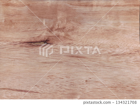 Light reddish-brown polished wood surface background texture close-up. 134321708