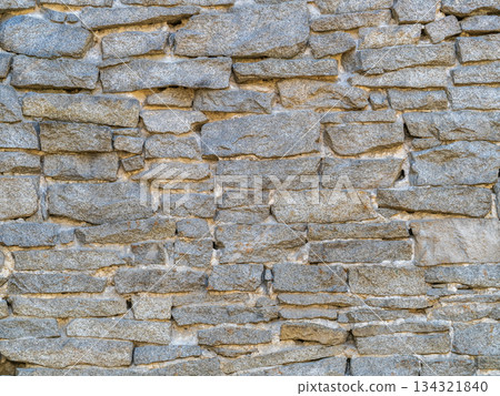 Backgrounds of the old fortress wall. Background of vintage stone wall Backgrounds of the old fortress wall. Background of vintage stone wall 134321840