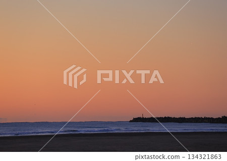 A sea stained in a morning glow 134321863