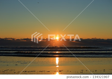 A sea stained in a morning glow 134321907