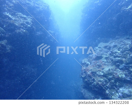 A view of rugged rocks lined up in the blue sea A view of rugged rocks lined up in the blue sea 134322208
