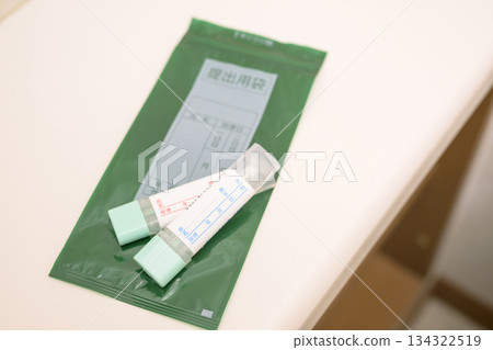 Stool test kit placed in the toilet 134322519