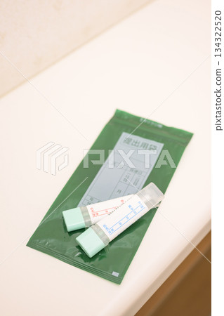 Stool test kit placed in the toilet Stool test kit placed in the toilet 134322520