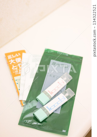 Stool test kit placed in the toilet Stool test kit placed in the toilet 134322521