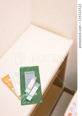 Stool test kit placed in the toilet 134322522
