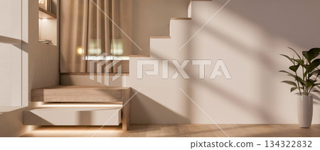 Sunlight shining on white wall of staircase and potted plant on wooden parquet floor in modern house 134322832