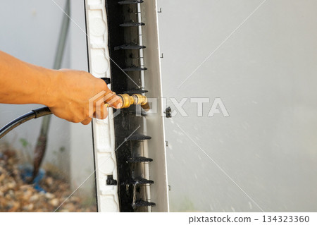 air conditioning cleaning service with water spray 134323360