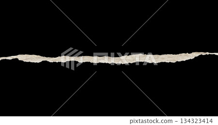 Ripped torn paper edges isolated on black background Ripped torn paper edges isolated on black background 134323414