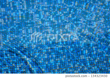 Swimming pool water surface and ripple wave with blue mosaic tiles Swimming pool water surface and ripple wave with blue mosaic tiles 134323430