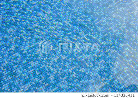 Swimming pool water surface and ripple wave with blue mosaic tiles 134323431