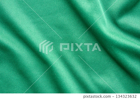 Green sports clothing fabric football shirt jersey texture close up Green sports clothing fabric football shirt jersey texture close up 134323632