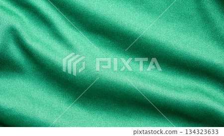 Green sports clothing fabric football shirt jersey texture close up Green sports clothing fabric football shirt jersey texture close up 134323633