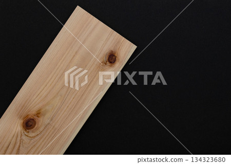 Beautiful wood grain and knots placed diagonally on a black background (cypress board) DIY, architecture, material image Beautiful wood grain and knots placed diagonally on a black background (cypress board) DIY, architecture, material image 134323680